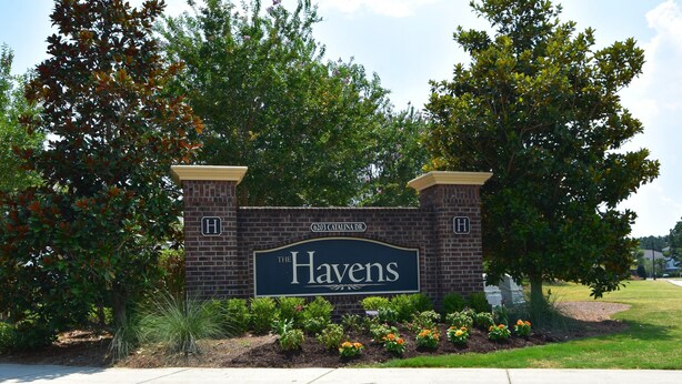 A brick sign with the name "The Havens" and an address.