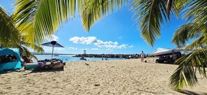On the beach, sun-loungers, beach towels