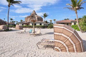 On the beach, sun-loungers