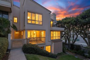 A two-story residential building with a balcony and a small porch area. - Beach Access, Pool, Spa, Tennis, 2 Bedroom + Private Den (Solana Beach)