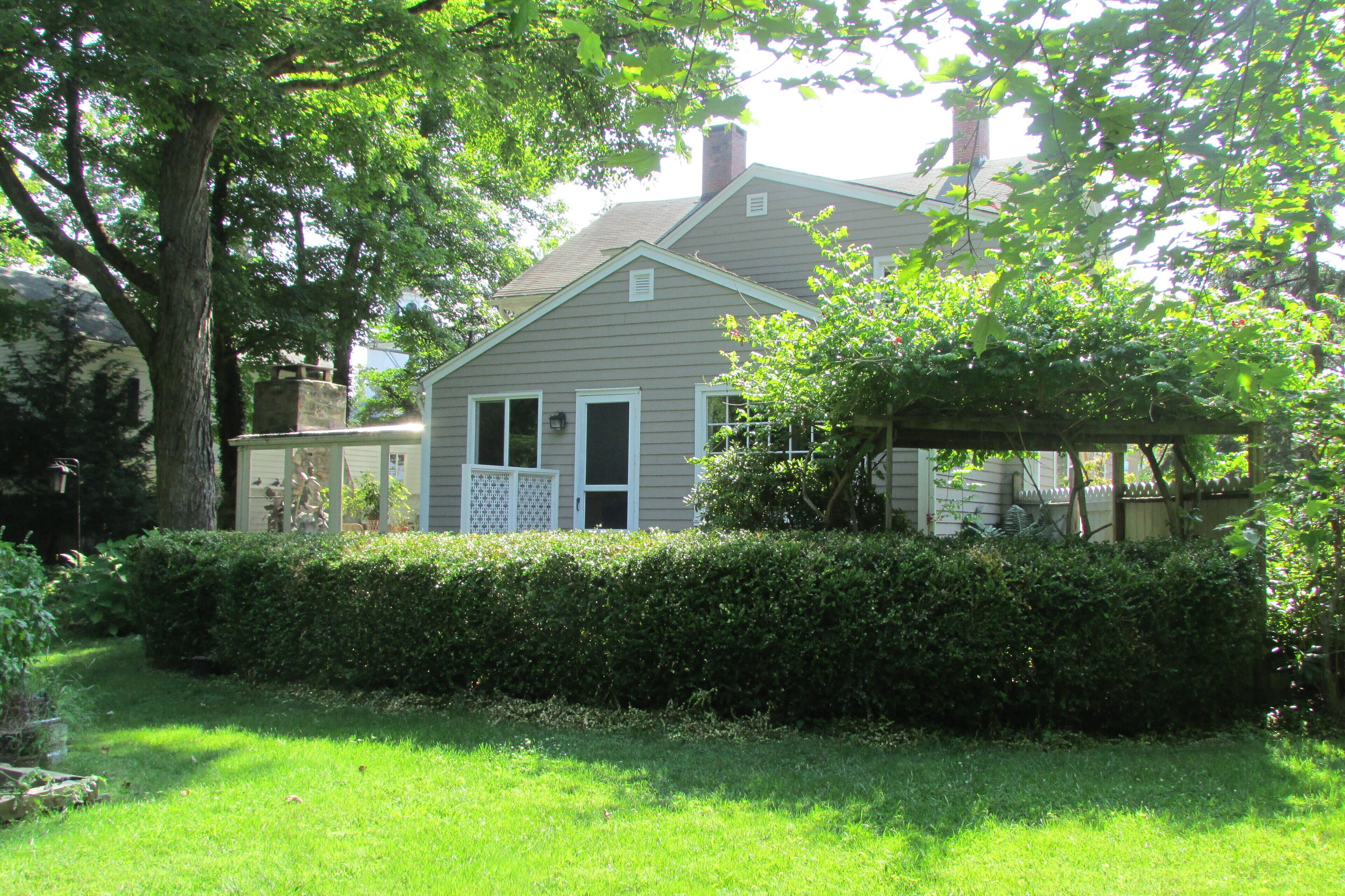 Remodeled 1795 Carriage House with two acres of gardens rimmed by forests