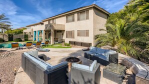 A modern house with a patio area featuring outdoor furniture, a fire pit, and a swimming pool. -  Private Backyard, Golf, Tennis, Spring Training, Wildlife Zoo, Westgate (Litchfield Park)
