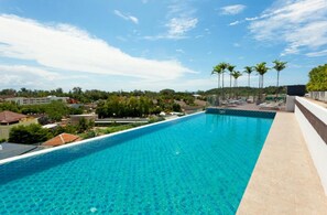 Outdoor pool, open 8:00 AM to 10:00 PM, pool loungers