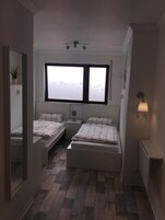 Doppel- oder Zweibettzimmer