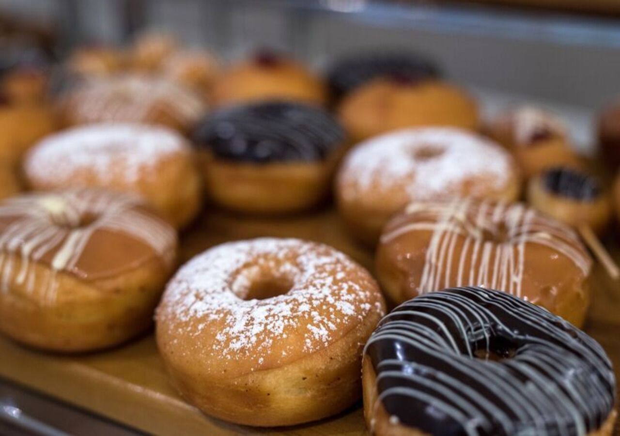A variety of donuts with different toppings and glazes.