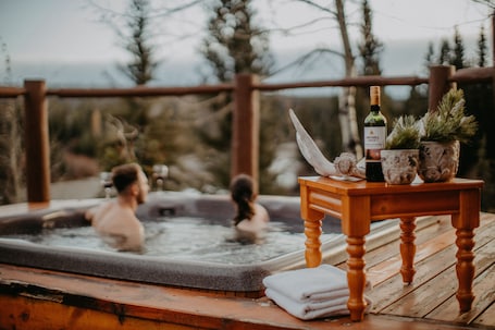 Outdoor spa tub. Big Creek Lodge - Working Guest Ranch