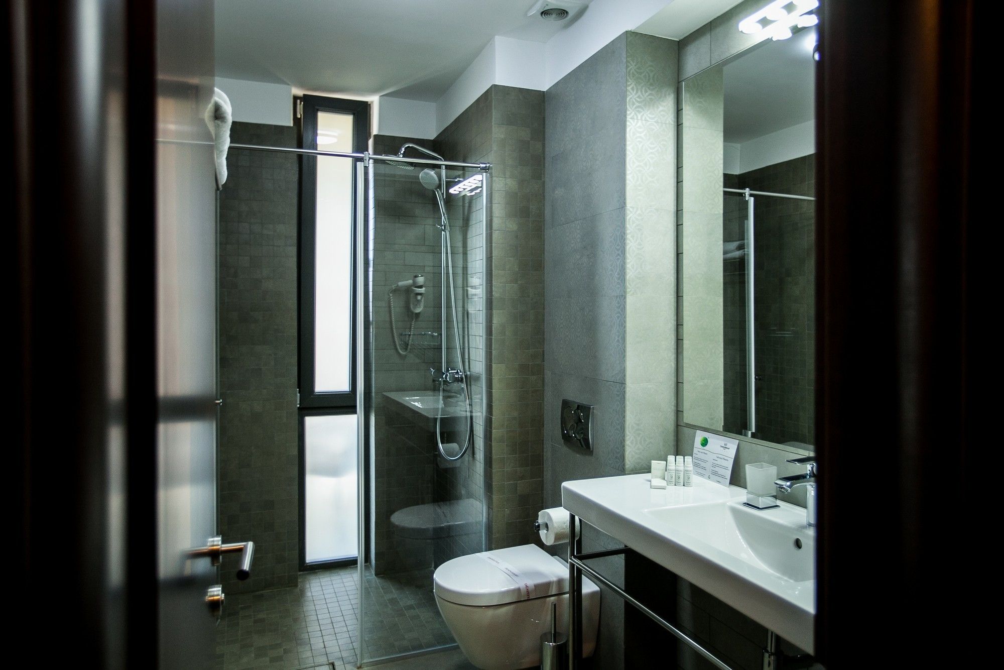 shower, bathrobes, slippers, towels