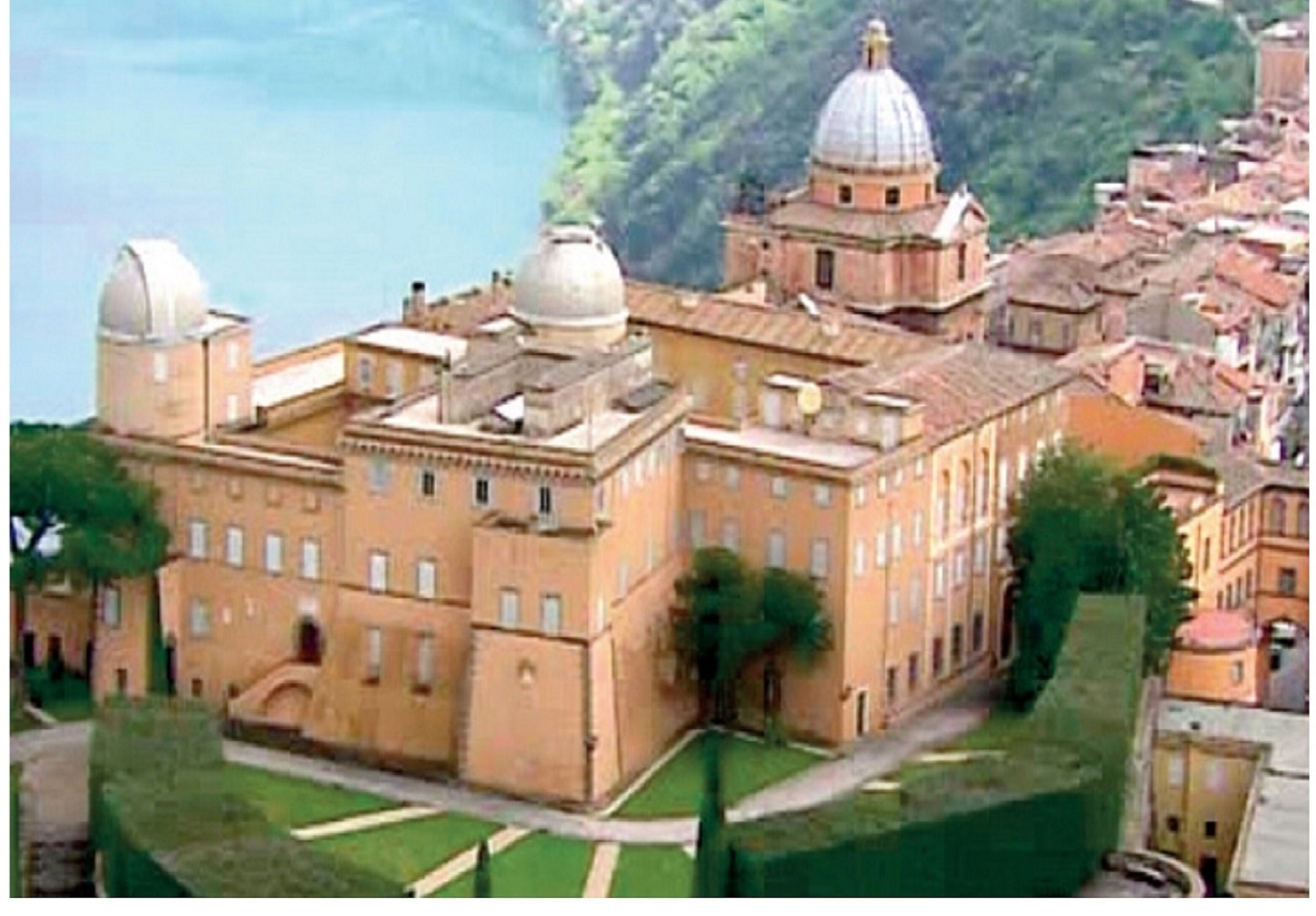 A large, historic building with multiple domes and a central courtyard.