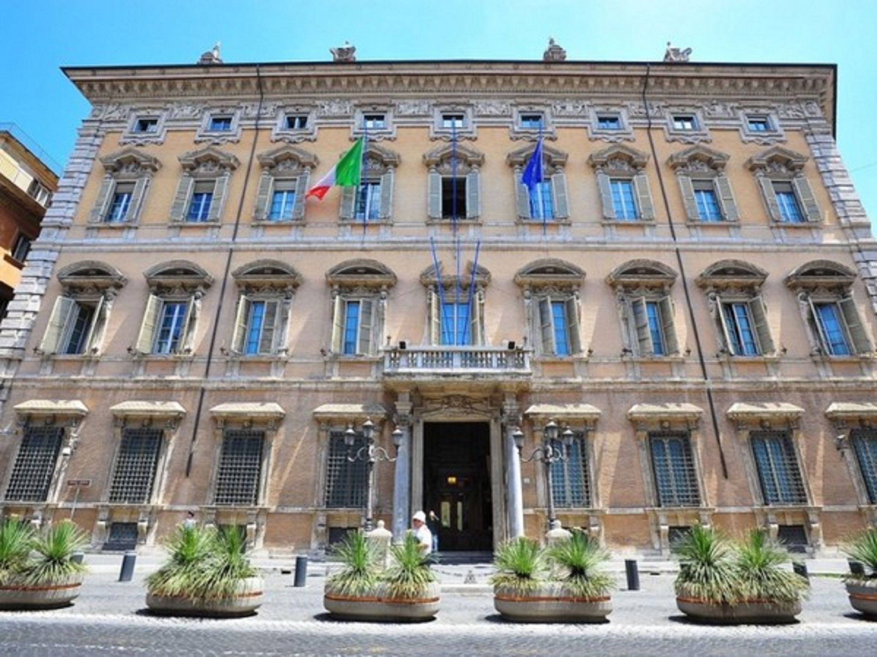 A historic building with a symmetrical facade, multiple windows, and a central entrance.