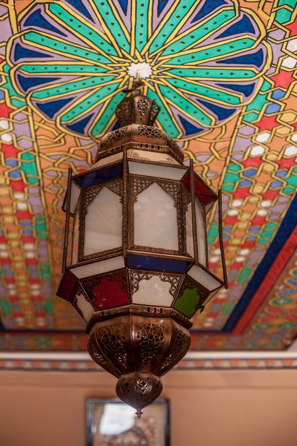 A detailed stained glass ceiling with a geometric pattern. - Kasbah Ait Kassi (Souk Lakhmis Dades)