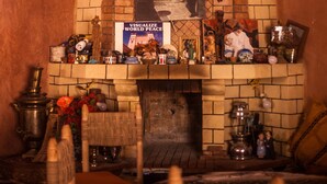 A traditional room with a brick fireplace, a wooden chair, and a small table with various items. - Kasbah Ait Kassi (Souk Lakhmis Dades)