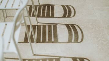 A close-up of a tiled floor with a geometric pattern.