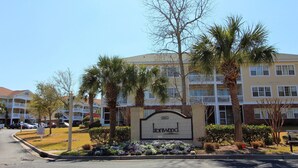 A residential building with a sign reading "Ironwood." - Ironwood Apartment 1631 (North Myrtle Beach)