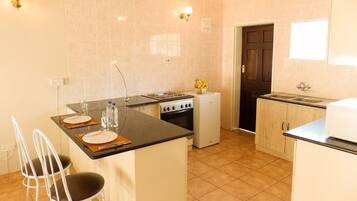 Family Suite, Multiple Beds, Non Smoking | Private kitchen | Fridge, electric kettle