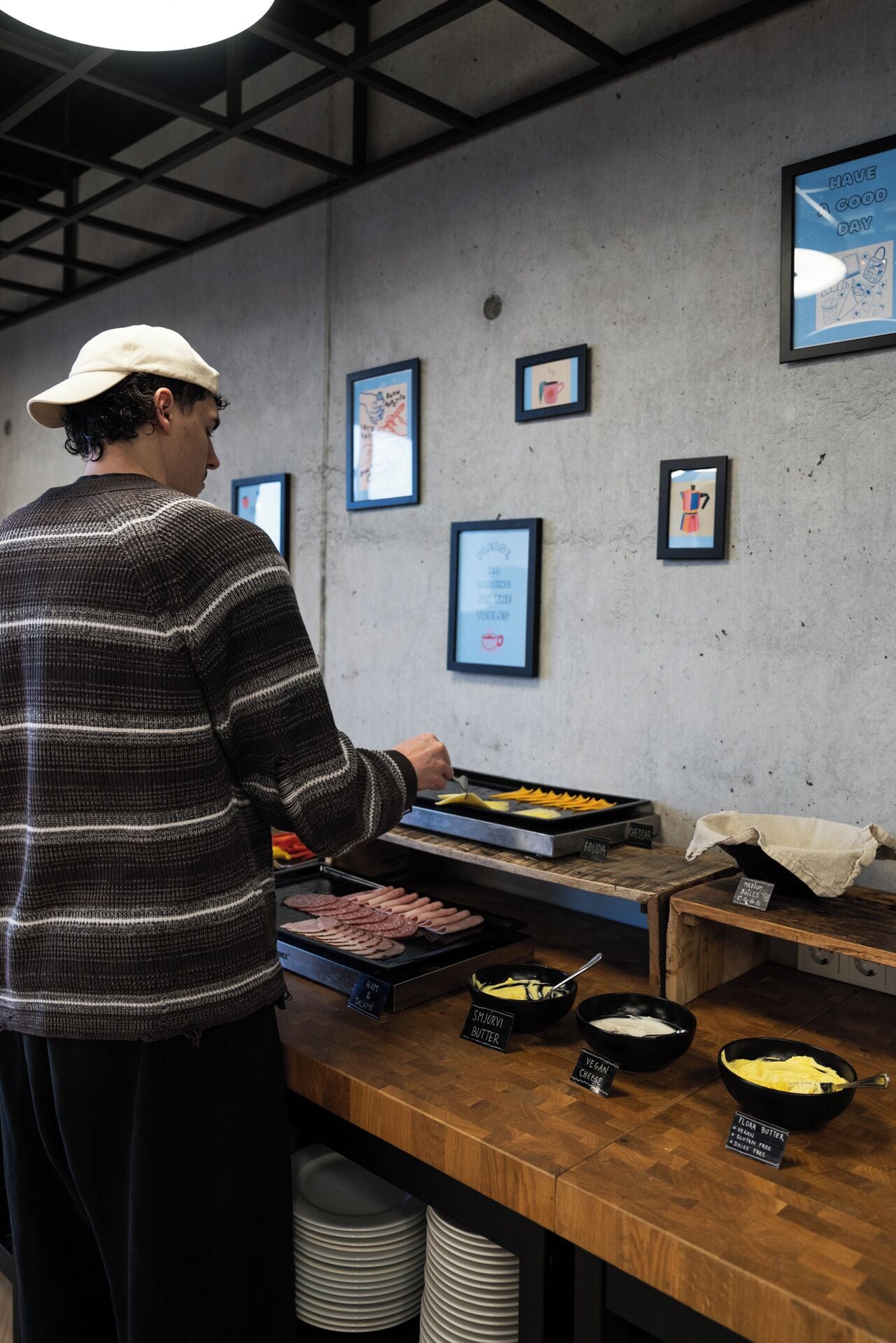 A person preparing food at a counter with various ingredients and utensils.
