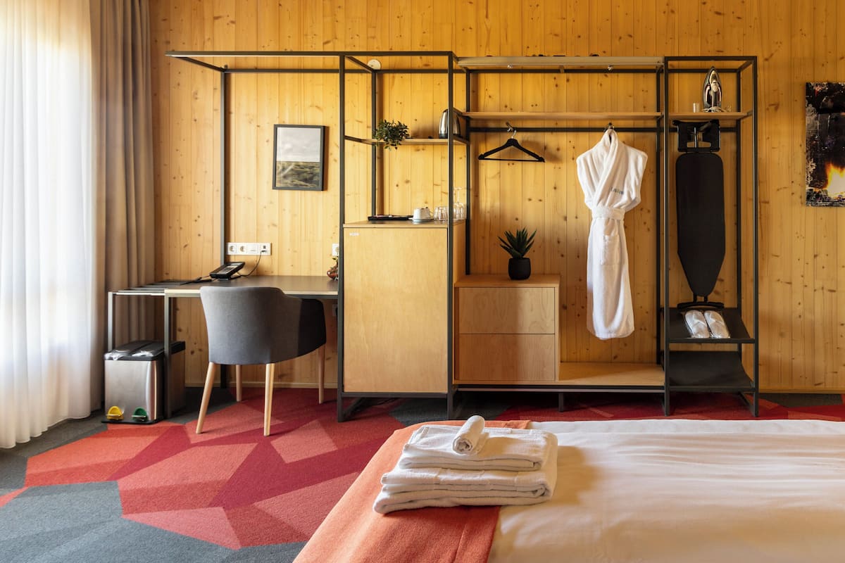 Family Room | Premium bedding, desk, blackout curtains, soundproofing