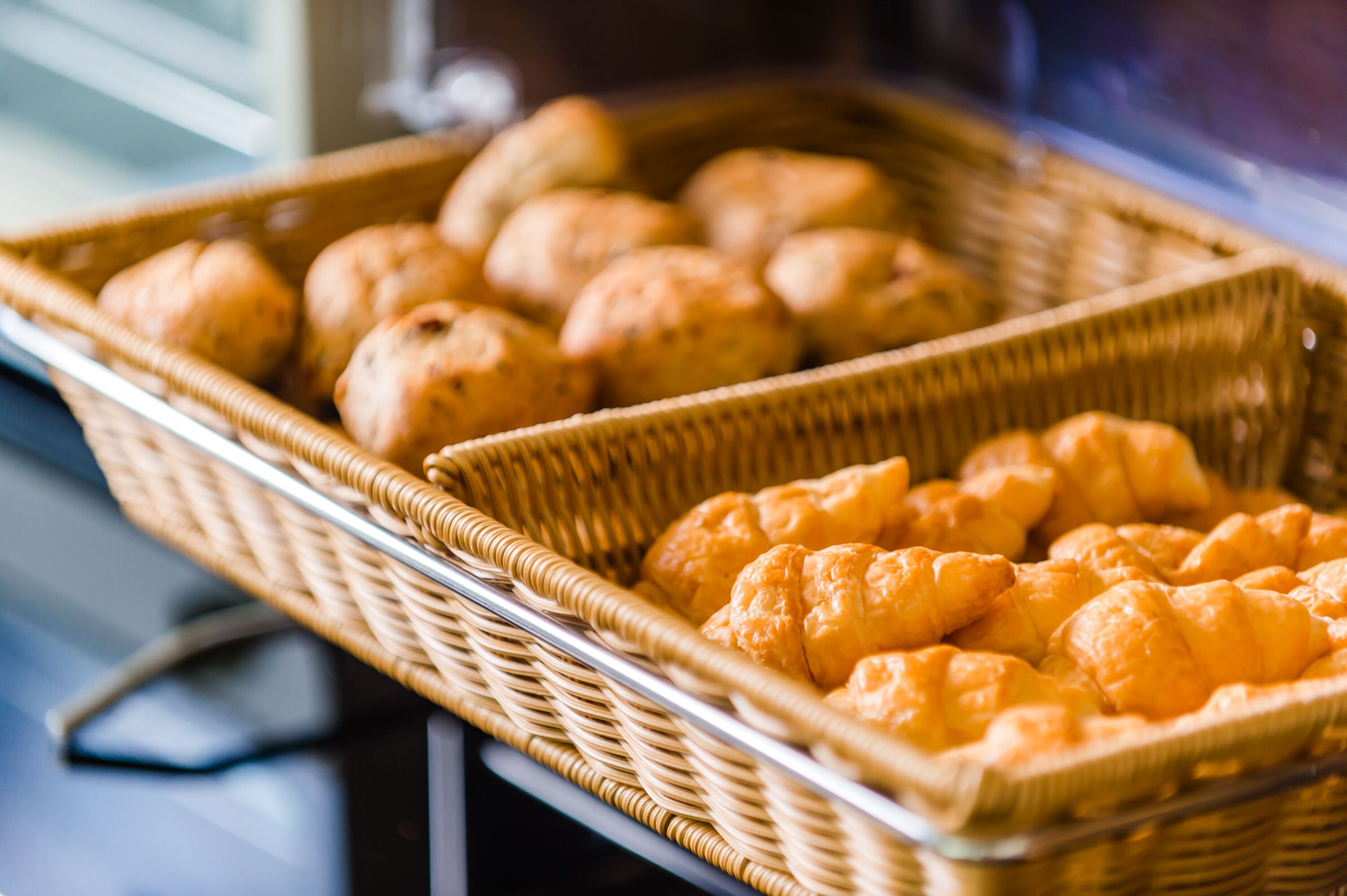 A wicker basket filled with pastries.