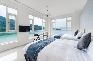 Deluxe Quadruple Room, Lake View | Blackout drapes, free WiFi, bed sheets