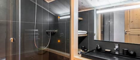 Shower, hair dryer, towels, toilet paper