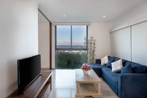Apartment, 1 Bedroom | Living area | Flat-screen TV