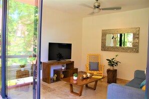 Apartment, 2 Bedrooms | Living room | Flat-screen TV - Profound relaxation in 2BR Condo with pool view by Happy Address (Tulum)