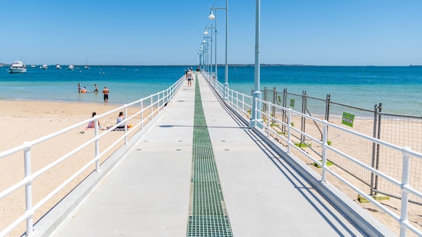 A pier extending into the sea with a clear sky. - Pelicans Rest Shoalwater Bay
Pelican Retreat (Shoalwater)