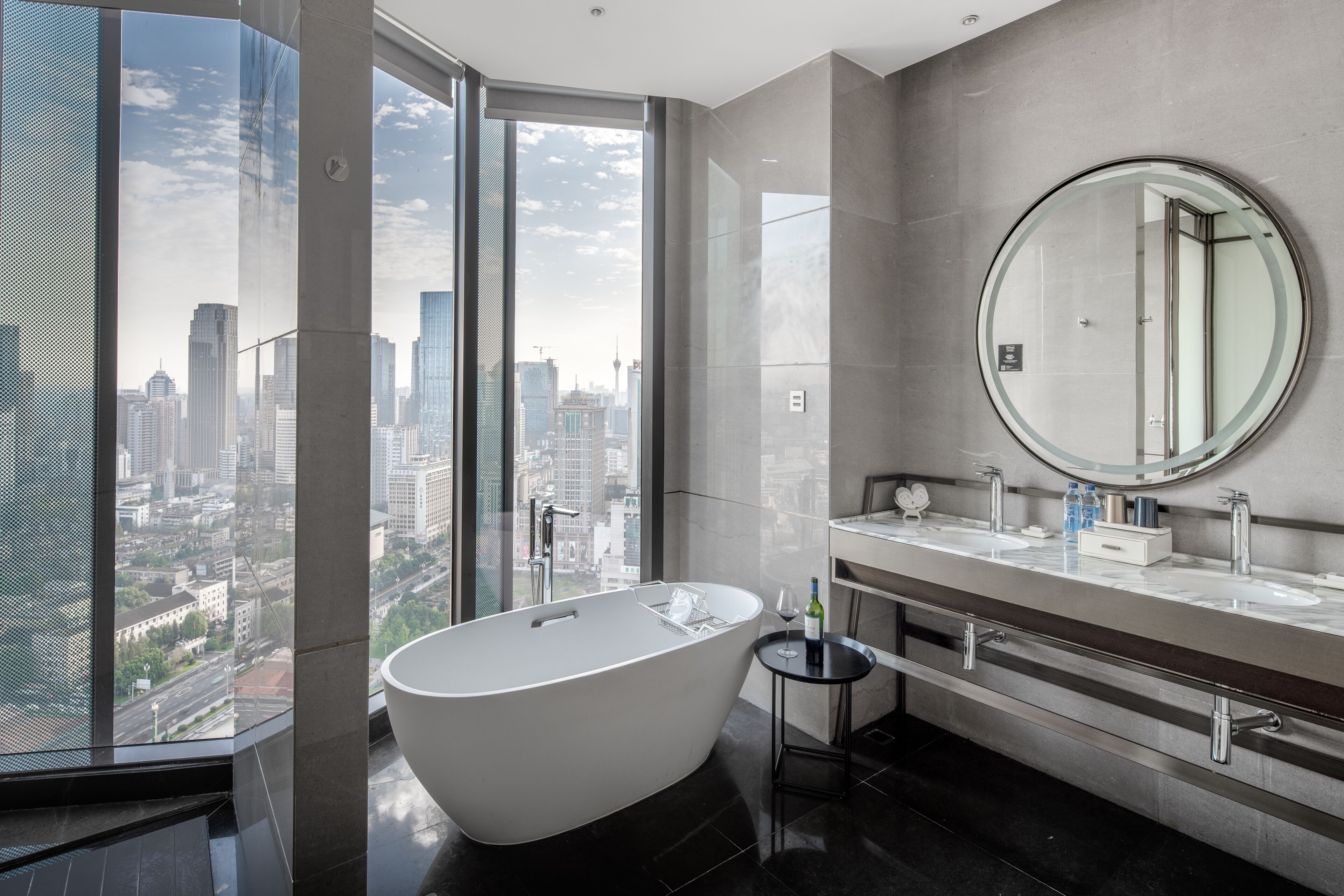king grand skyline tianfu square view suite | bathroom | deep-soaking bathtub, rainfall showerhead, free toiletries, hair dryer