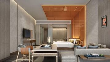 Una habitación de hotel moderna con cama, zona de estar, televisor y escritorio.
