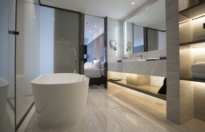 Separate bathtub and shower, free toiletries, hair dryer, slippers