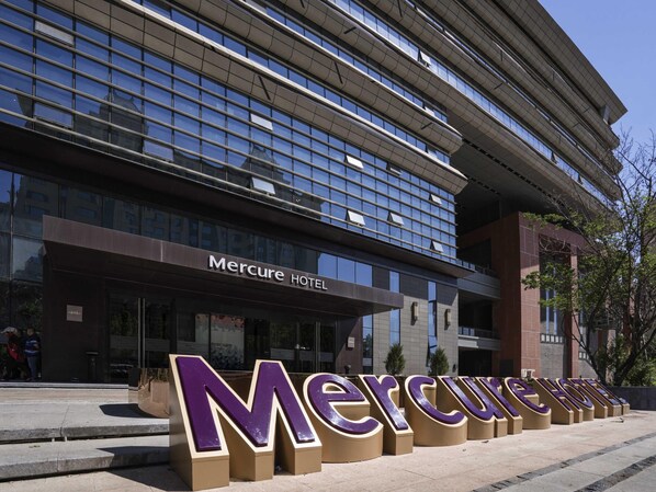 A modern hotel building with large signage reading 'Mercure Hotel.' - Mercure Panjin (Panjin)