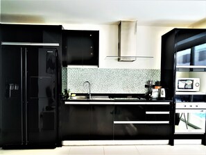 Exclusive Apartment, 2 Bedrooms, Sea View | Private kitchen | Full-size fridge, microwave, oven, stovetop