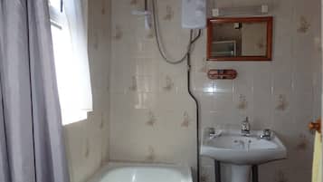Combined shower/bathtub, soap, toilet paper