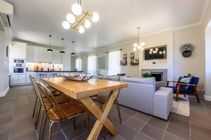 Cozy living space with a dining area, comfortable seating, and a fireplace.