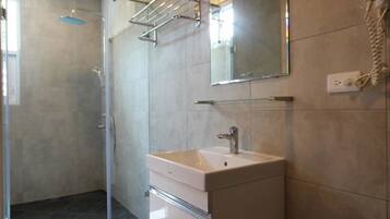 Deluxe Quadruple Room, 2 Double Beds, Non Smoking | Bathroom | Shower, rainfall showerhead, free toiletries, hair dryer