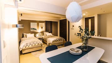 Deluxe Family Room | Individually decorated, individually furnished, desk, blackout drapes