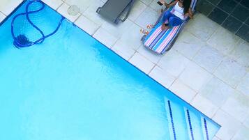 Seasonal outdoor pool, open 8 AM to 6 PM, pool loungers