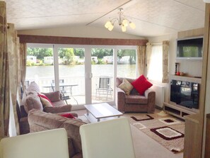Mobile Home (Cedar Lake 37) | Living area | Flat-screen TV - Caravan Hire at Southview Leisure Park (Skegness)