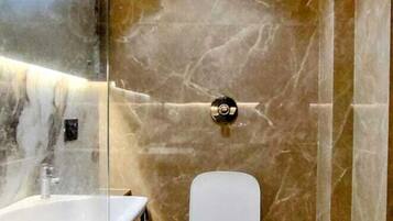 Shower, rainfall showerhead, hair dryer, towels