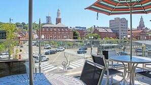 A balcony with a view of a cityscape, including buildings and a street. - Homewood Suites by Hilton Providence Downtown (Providence)