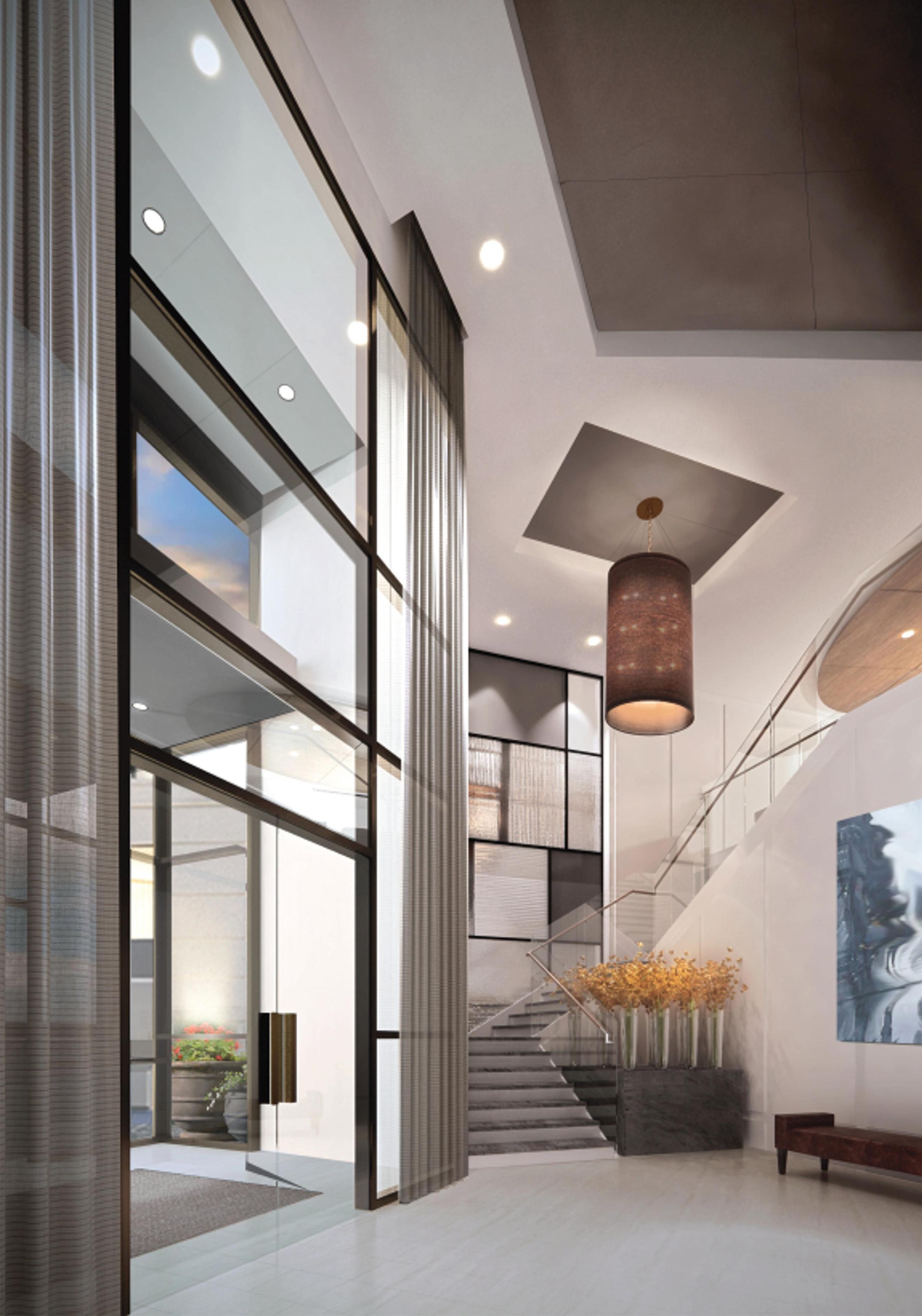 A modern interior with a staircase, a hanging light fixture, and a large window.