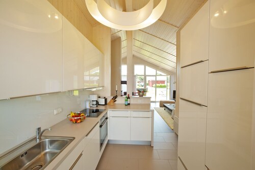  Exklusives Holzhaus mit hohem Wohngefühl direkt am Nordseedeich