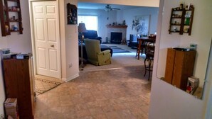 A living room with a fireplace, a sofa, and a dining area. - Cleveland Airport
Bundle yourselves together (Brook Park)