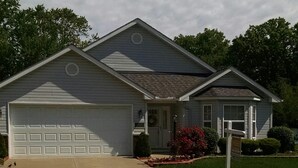 A single-story house with a garage, a front porch, and a small garden with red flowers. - Cleveland Airport
Bundle yourselves together (Brook Park)