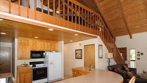 A spacious kitchen with wooden cabinets, a microwave, stove, and a large island. - Excepional spacious lodge 5 min frm Roslyn slps 12, huge loft, WIFI, Hot Tub,  (Ronald)
