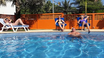 Outdoor pool, open 8 AM to 9 PM, pool umbrellas, pool loungers