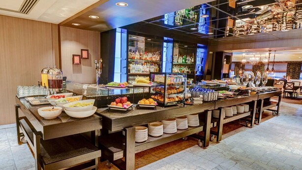 A buffet setup with various food items and beverages. - Rock Star Hotel (Pushkar)