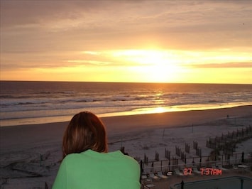 Enjoying my favorite time of the day at the beach on the balcony