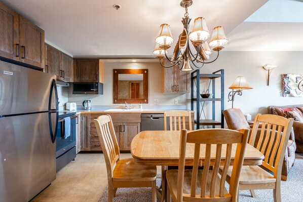 Enjoy cooking in the well-equipped kitchen with a refrigerator, oven, and dining area.