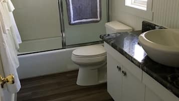 Combined shower/tub, hair dryer, towels, soap