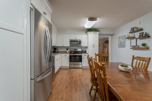 Enjoy cooking in this well-equipped kitchen with a dining table and central island.